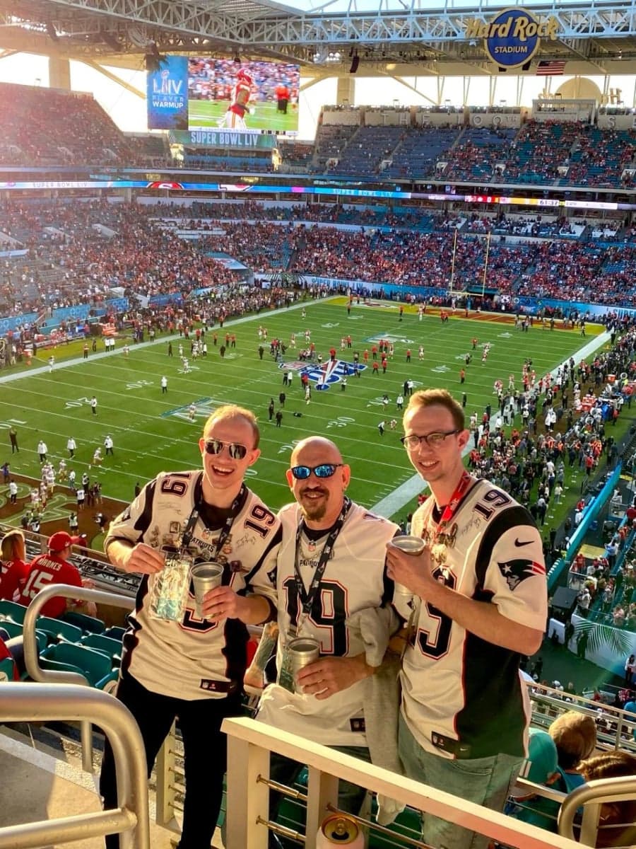 The brothers with their dad at Super Bowl LIV